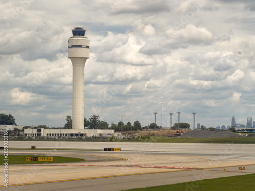 Konstfotografi Charlotte Douglas International airport air traffic control tower along a runway