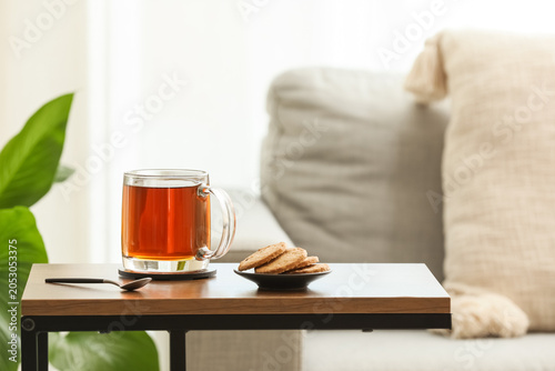 Glass cup of hot black tea ...