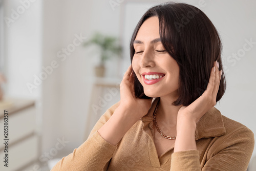 Smiling woman with closed e...