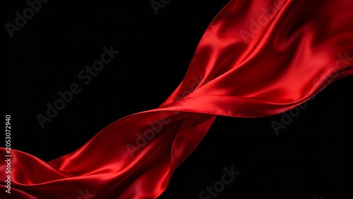 Red fabric flowing against black background