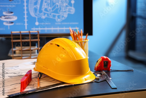 Hardhat with tools on engin...