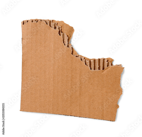 Torn piece of cardboard iso...