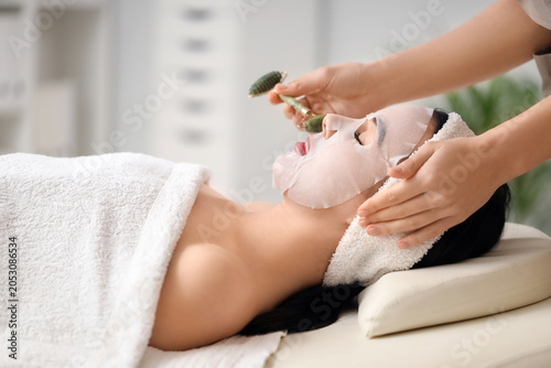 Cosmetologist with massage ...