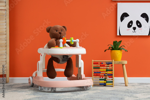 Baby walker with toy bear a...