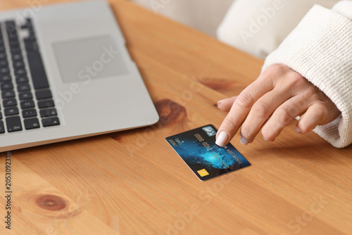 Muslim woman with credit ca...