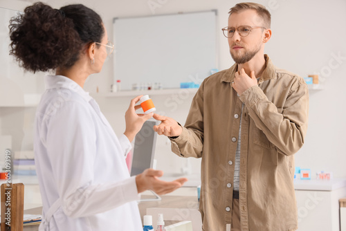 Pharmacist consulting male patient about medication healthcare and pharmacy s...