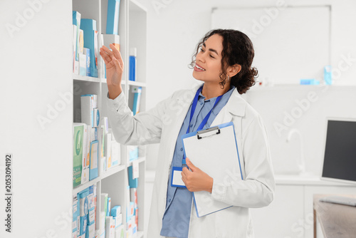 Smiling female pharmacist o...