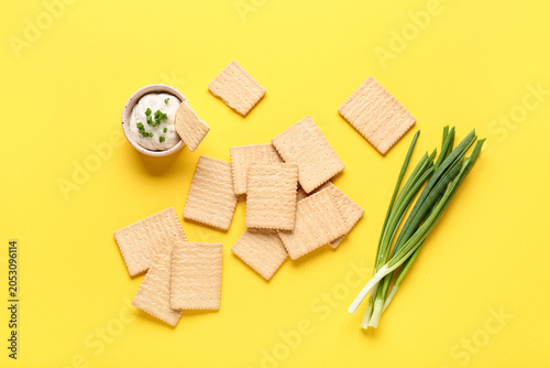 Tasty crackers with bowl of...