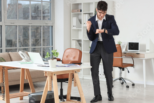 Excited young businessman c...