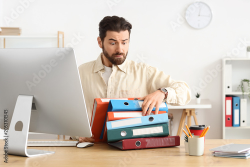 Overwhelmed businessman man...