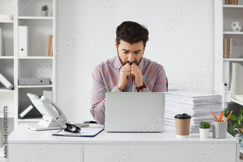 Stressed businessman overwh...