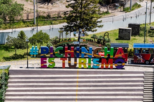 Colorful Sign in Pichincha Promotes Tourism During Bright Daylight