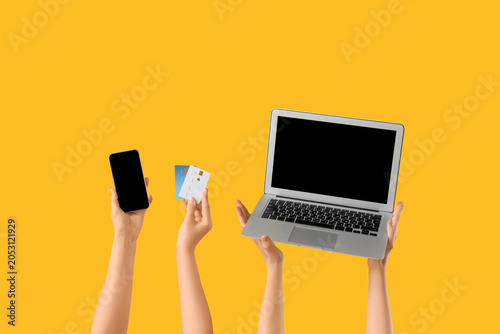Hands with mobile phone, la...