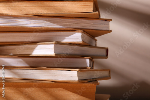 Stack of books on beige bac...