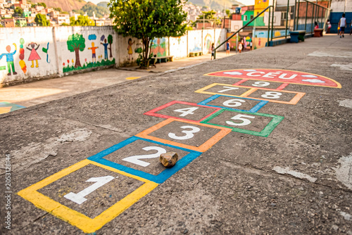 Colorful hopscotch playground in urban community schoolyard