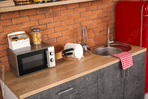 Microwave oven with utensil...