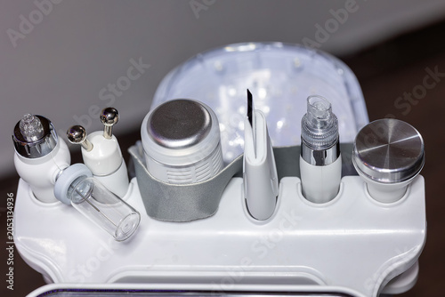 Vászonkép Close up of professional multifunction skincare device with various treatment attachments used for facial procedures in beauty clinic