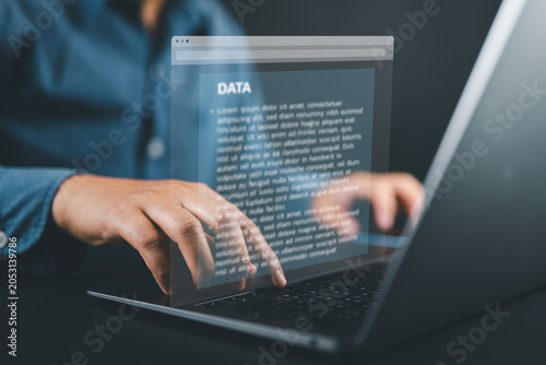 Tableau sur toile Document writing software concept with businessman typing on laptop, representing word processing, business text editing, content creation, and digital document management