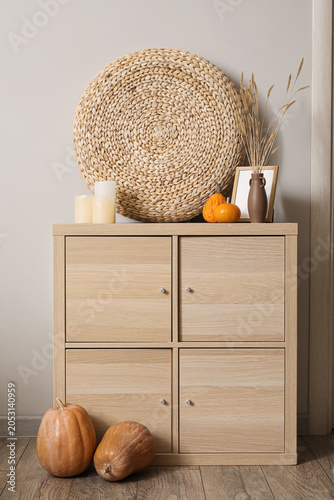 Wooden cabinet with pumpkin...