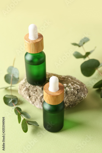 Bottles of cosmetic oil wit...