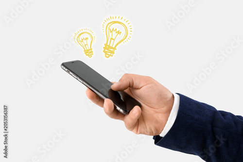 Young businessman using mob...