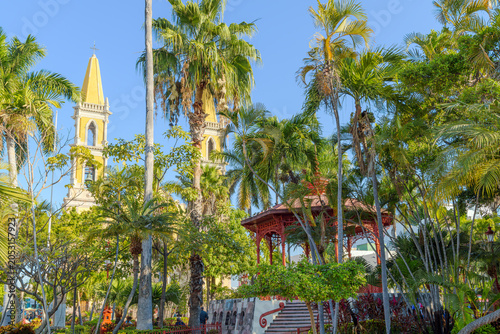 The historic Plaza Republica Square, with the red iron gazebo and Immaculate Conception church in view, in the historic center of Mazatlan, Mexico.