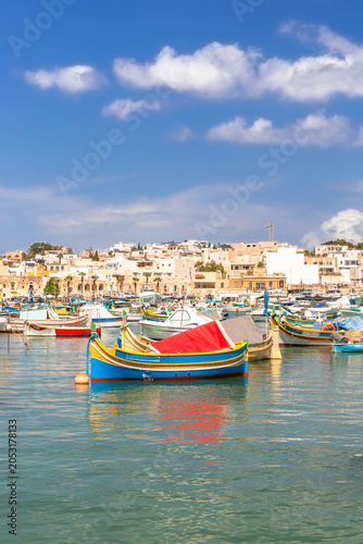 Marsaxlokk village harbor of Malta, Mediterranean traditional colorful boats luzzu.
