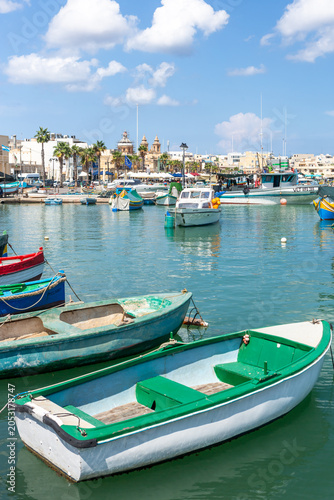Marsaxlokk village harbor of Malta, Mediterranean traditional colorful boats luzzu.