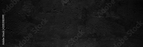 Cuadro en lienzo Black wall with cracks and dark shading, great for backgrounds in design projects needing a distressed look