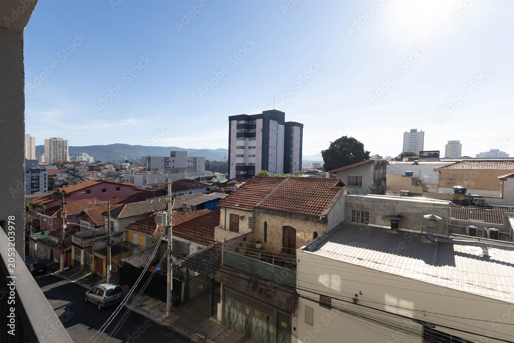 Fototapeta premium Sezefredo Fagundes neighborhood in the northern zone of São Paulo, with a view of the Serra da Cantareira mountain range.
