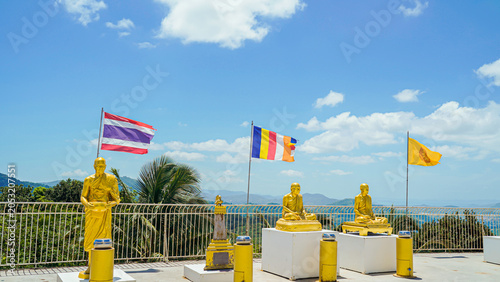 Phuket Big Buddha statue. afternoon light sky and blue ocean are on the back of white Phuket big Buddha is the one of landmarks on Phuket island Thailand.