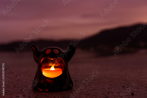 Concept: Halloween beach and ocean background with sea ghost with witch ghost fire, dark, scary tone.