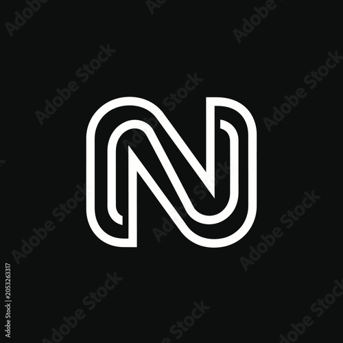 Fotografía Black background with a bold, white convoluted letter 'N' logo design