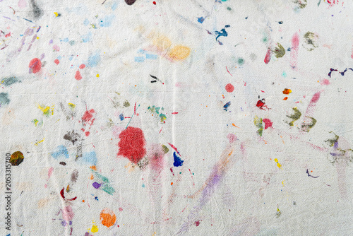 Dirty artist canvas with brush marks, paint stains, and creative texture