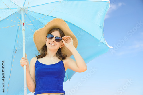 Smiling young woman in stra...