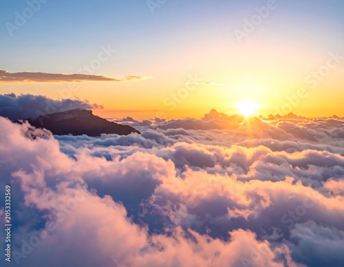 A serene sunset above fluffy clouds with a mountain