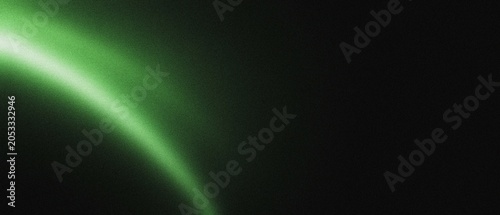Foto Abstract green light streak on a dark background with soft focus and copy space