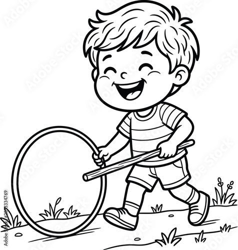Photos A joyful little boy playing with a rolling hoop and a wooden stick in a sunny meadow during a pleasant outdoor day