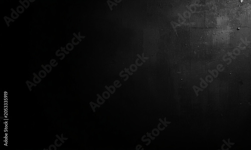 Dark Textured Surface with Subtle Light Reflection and Grain Detail