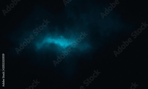 Ethereal blue light glowing through dark mystical clouds during nighttime creating a dramatic atmospheric effect