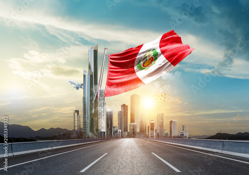 Φωτογραφία Peru flag waving with modern and developed landscape