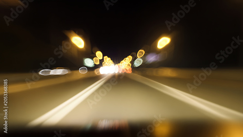 Blurred Night Drive Through City Lights Abstract Motion Blur.