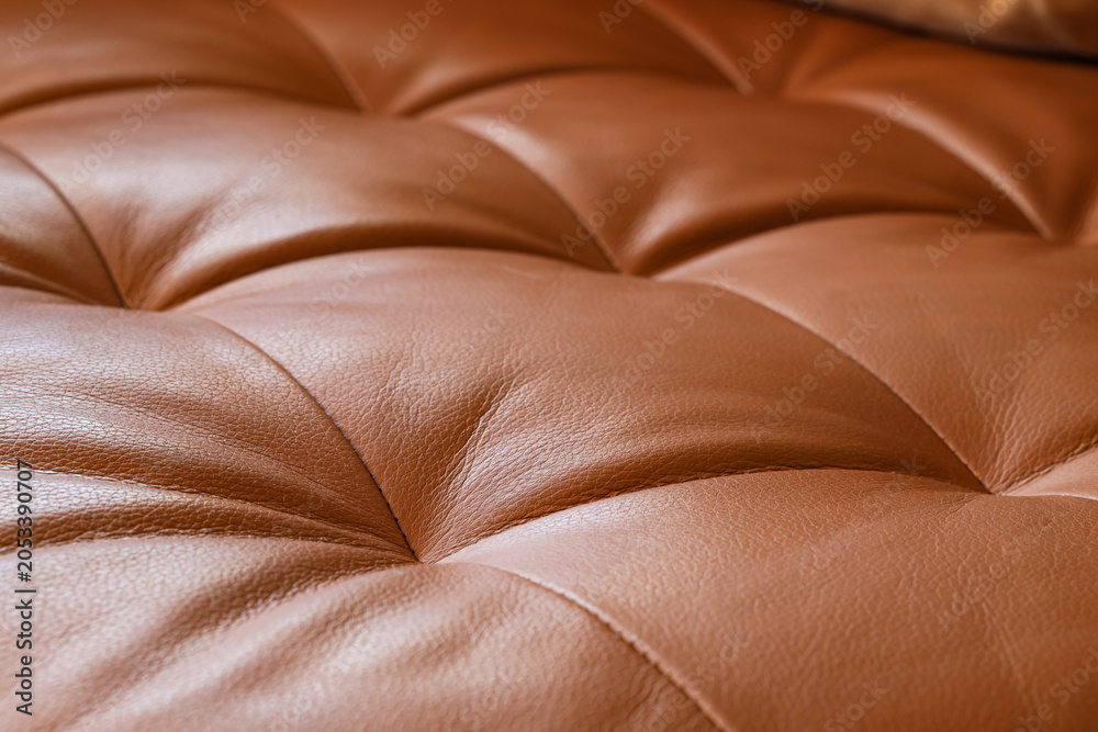 Naklejka premium Brown tufted leather upholstery texture, luxurious furniture material, elegant interior design detail, high-quality craftsmanship