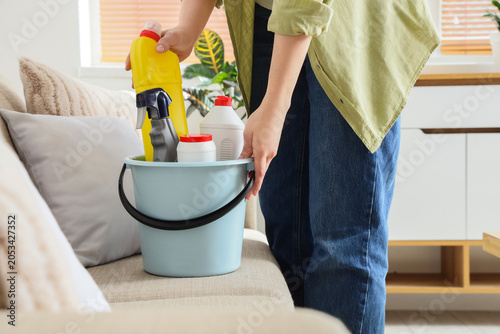 Person carrying cleaning su...