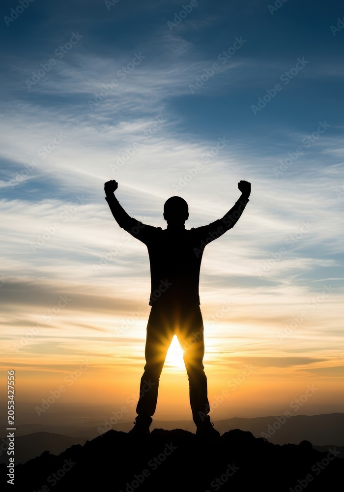Fototapeta premium Silhouette of a Triumphant Man Standing on Mountain Peak with Arms Raised at Sunset - Success and Achievement Concept