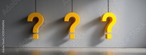 Three golden question marks hang against a textured wall