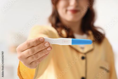 Woman holding negative preg...