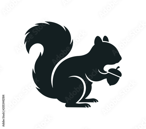 Silhouette of a Squirrel Holding an Acorn.