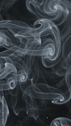 Abstract smoke particles drifting slowly across transparent background.