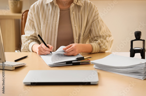 Professional woman writing ...